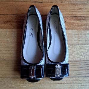 Cream and black flats